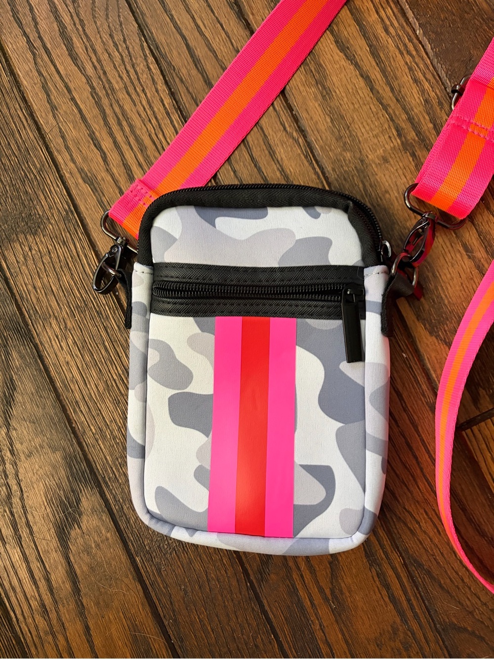 Haute Shore Casey crossbody bag in a gray camo pattern w/pink & orange stripes